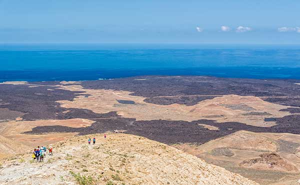 Hikers on Caldera Blanca in Lanzarote, the Canary Islands