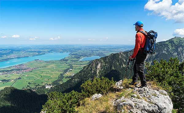 Hiker looking to Forggen Lake in Germany